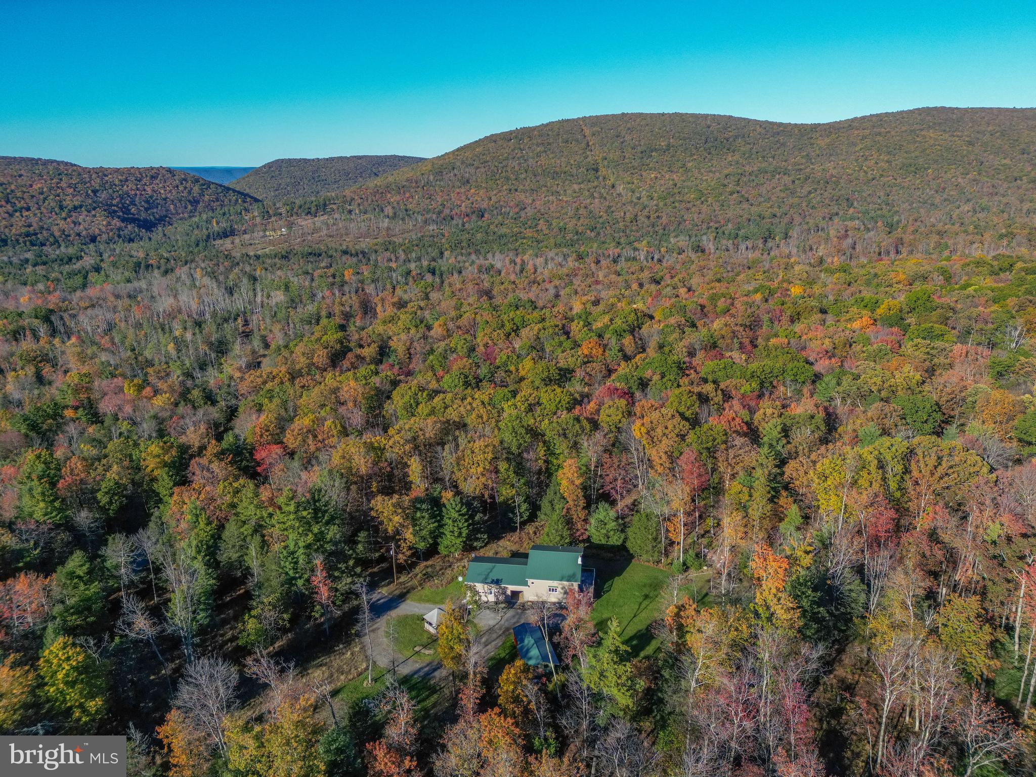 an aerial view of residential house and green space