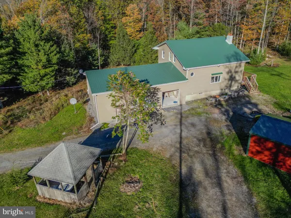 an aerial view of a house with a garden