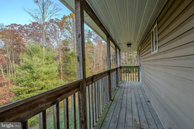 a view of balcony with wooden floor