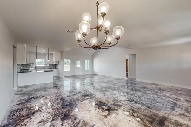 a view of a kitchen with a sink and cabinets