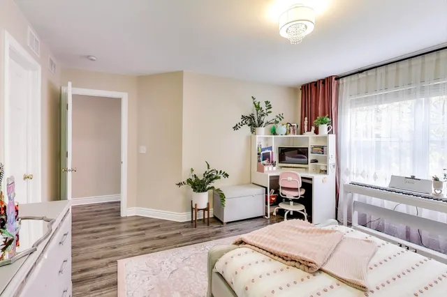 a bedroom with furniture and a window