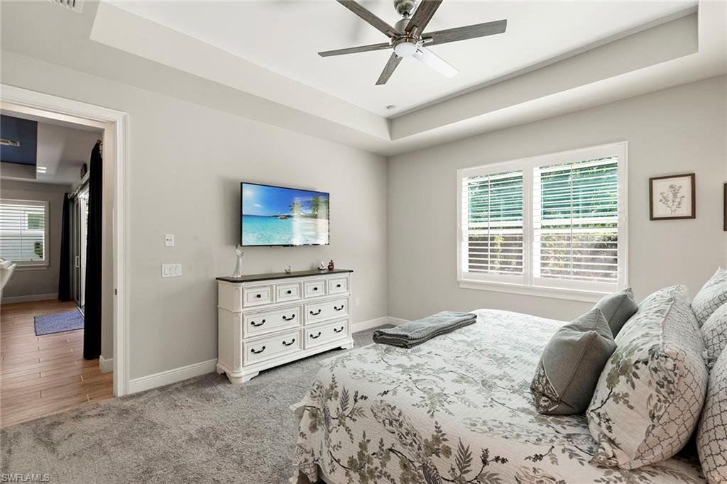 14796 Windward Lane Naples, FL 34114 - Photo 19 of 50 a bedroom with a bed and a window