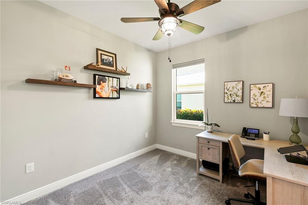 14796 Windward Lane Naples, FL 34114 - Photo 22 of 50 a view of a workspace with furniture and a window