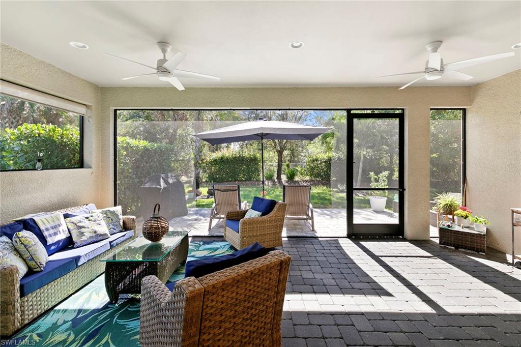 14796 Windward Lane Naples, FL 34114 - Photo 30 of 50 a living room with furniture and a large window