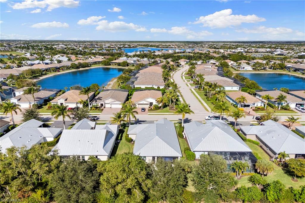 14796 Windward Lane Naples, FL 34114 - Photo 37 of 50 an aerial view of residential houses with outdoor space