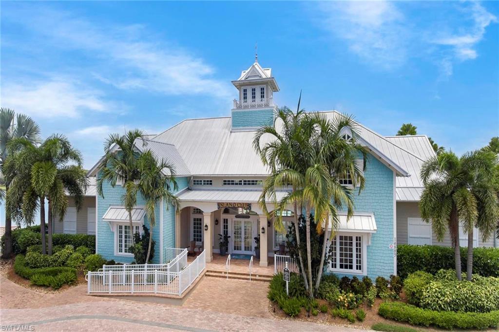 14796 Windward Lane Naples, FL 34114 - Photo 40 of 50 a front view of a house with a yard
