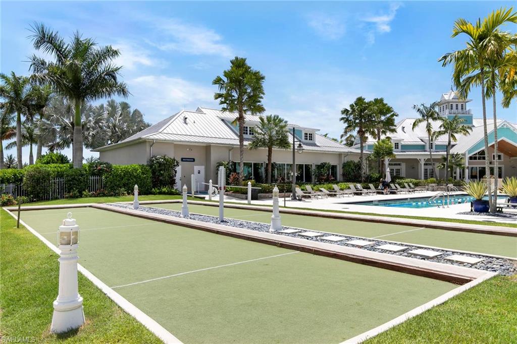 14796 Windward Lane Naples, FL 34114 - Photo 47 of 50 a view of a swimming pool and lounge chairs