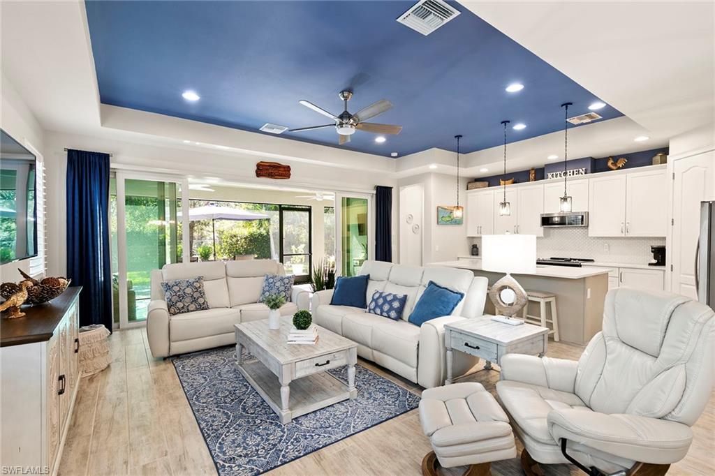 14796 Windward Lane Naples, FL 34114 - Photo 5 of 50 a living room with furniture and a large window