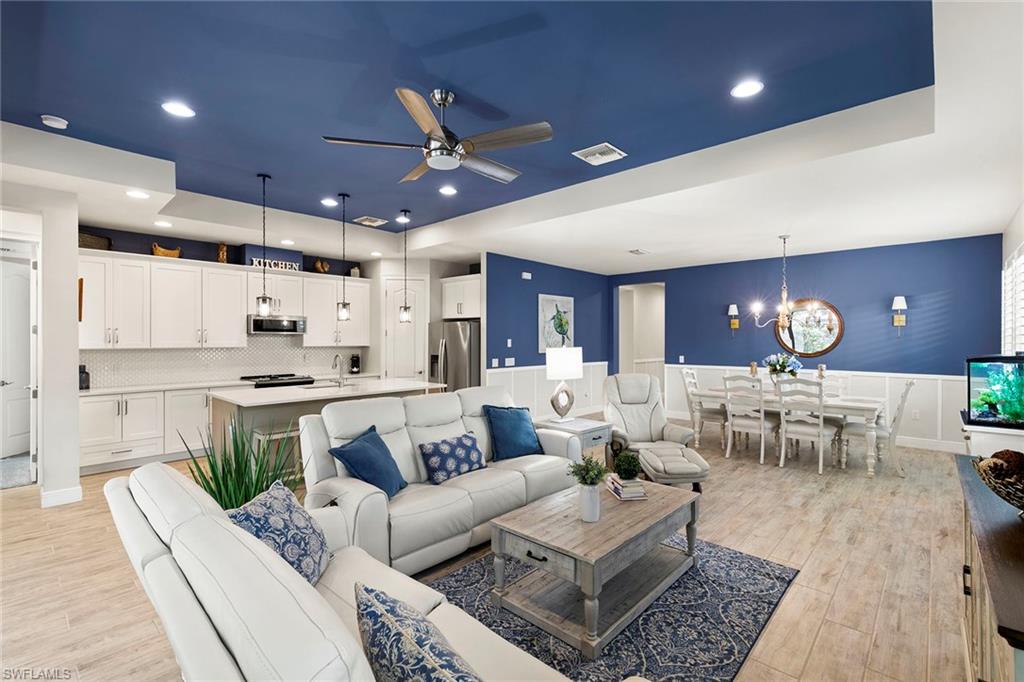 14796 Windward Lane Naples, FL 34114 - Photo 7 of 50 a living room with lots of furniture and view of kitchen
