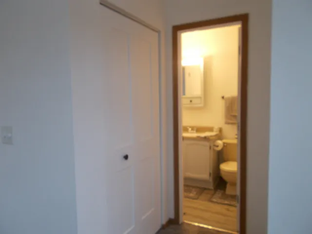 a bathroom with a glass shower door