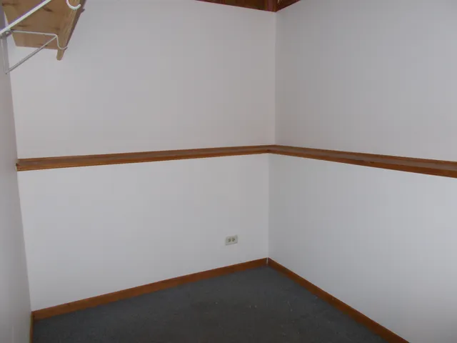 a view of a hallway with closet
