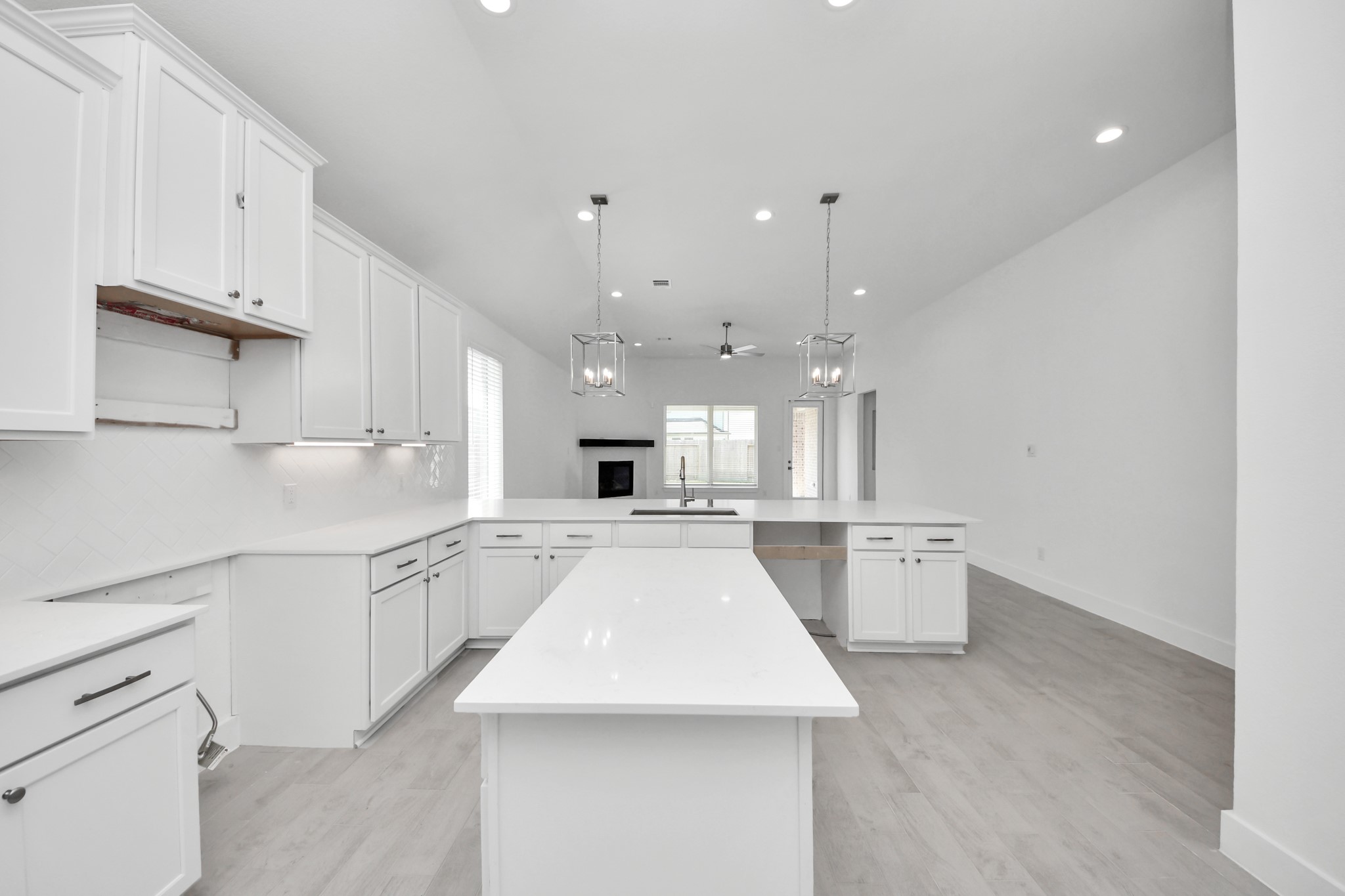 3042 Native Spg Drive Spring, TX 77373 - Photo 23 of 40 The open concept effortlessly connects the kitchen to the expansive family room, forming a perfect hub for gatherings. This seamless flow creates an inviting space where cooking and socializing come together harmoniously.