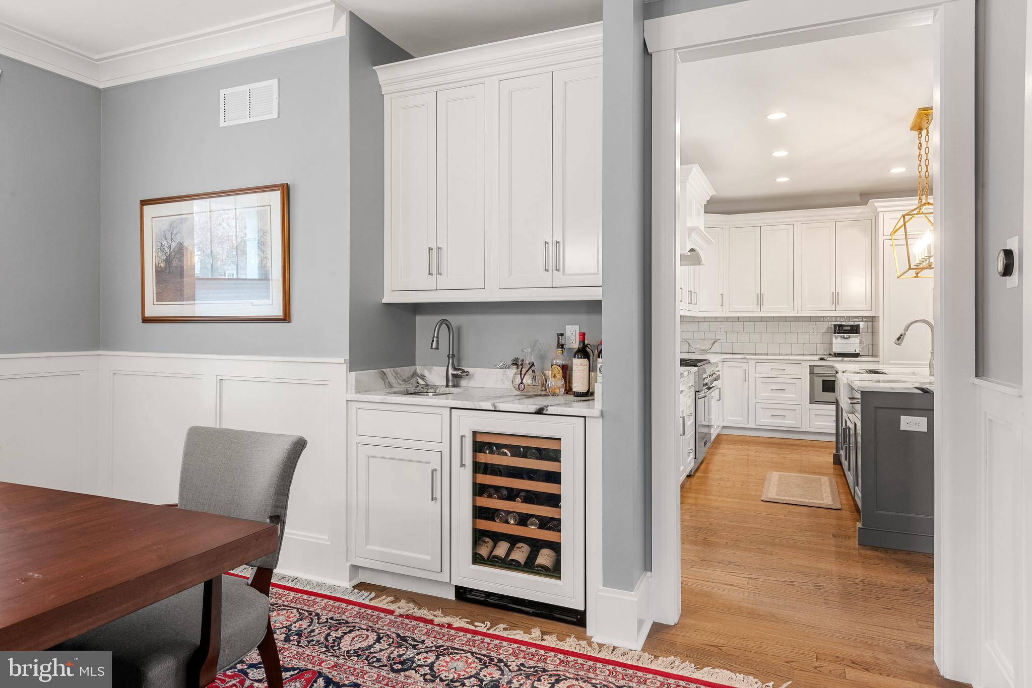 2 West 8th Street Media, PA 19063 - Photo 8 of 51 a kitchen with stainless steel appliances granite countertop a stove and white cabinets