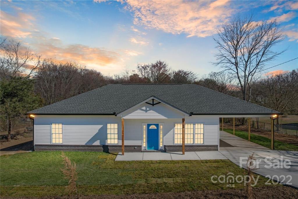 148 1st Street South Fort Mill, SC 29708 - Photo 1 of 48 a front view of a house with a yard and garage
