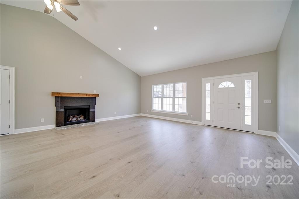 148 1st Street South Fort Mill, SC 29708 - Photo 45 of 48 a view of an empty room with a fireplace and window