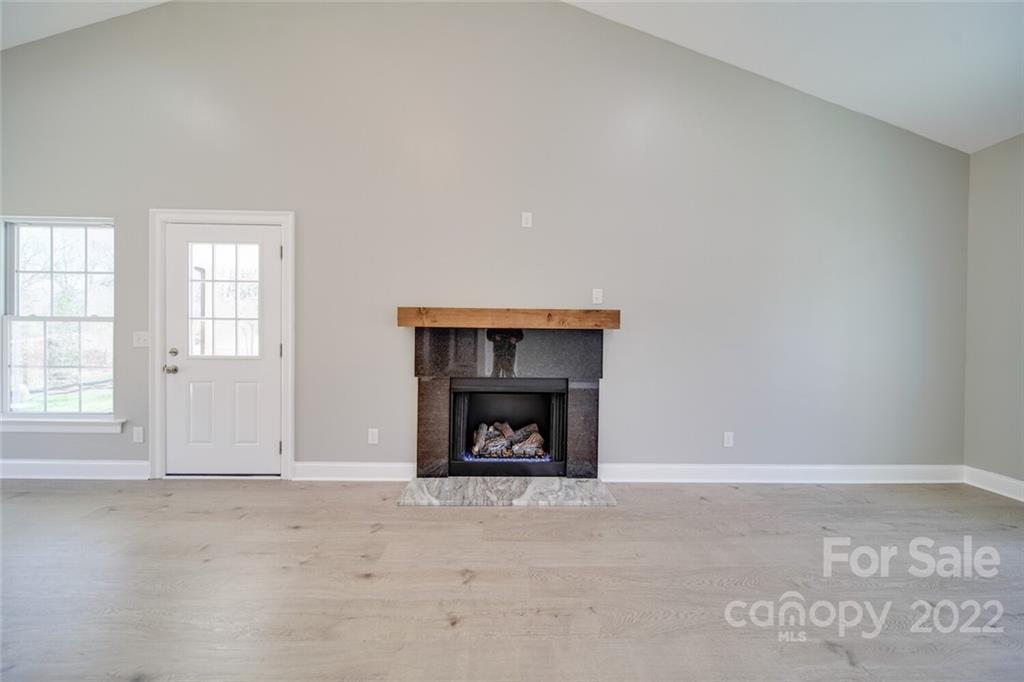 148 1st Street South Fort Mill, SC 29708 - Photo 46 of 48 an empty room with a fireplace and window