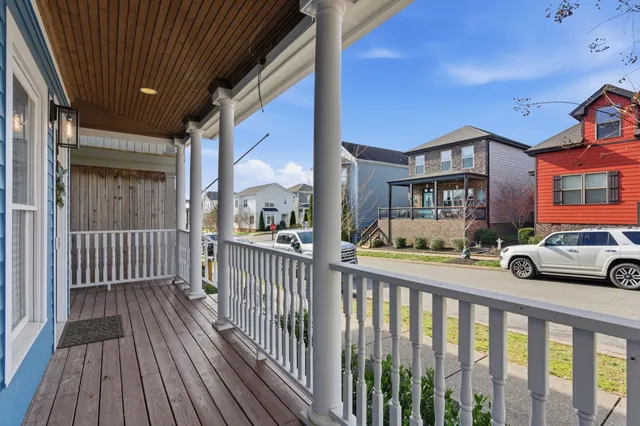 a view of a porch with wooden floor