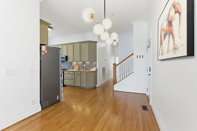 a view of a kitchen with wooden floor