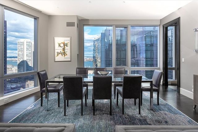a view of a dining room with furniture and window