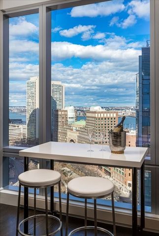 a view of a dining room with furniture and window