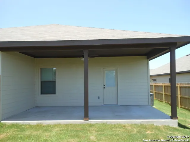 a view of backyard with front door
