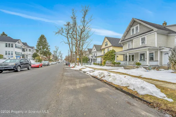 a view of a street with cars