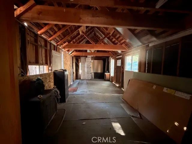 a view of a house with a tree on the ground