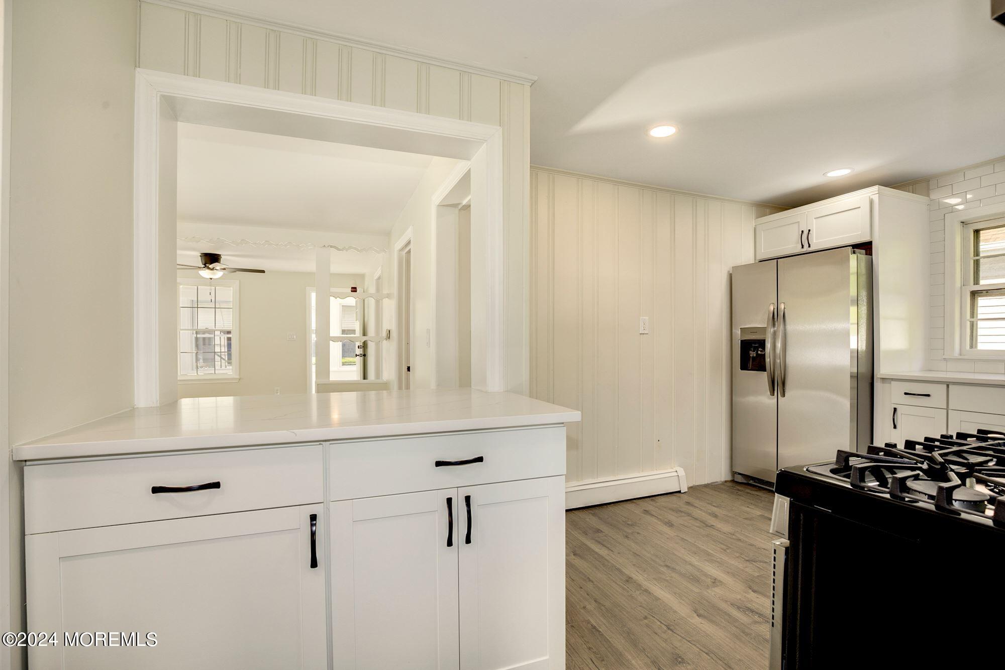 198 Newman Springs Road Red Bank, NJ 07701 - Photo 3 of 13 a kitchen with a refrigerator and a stove