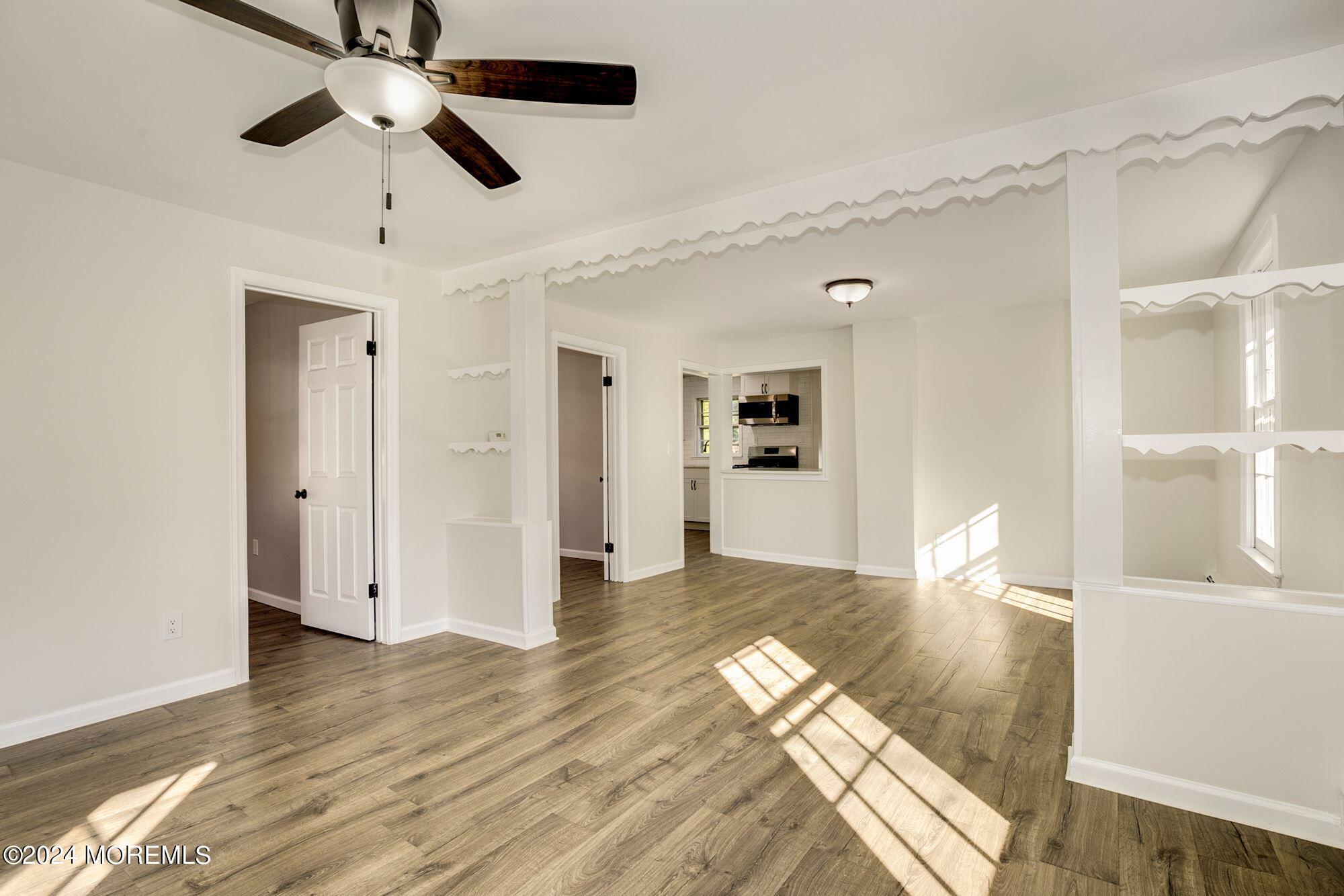 198 Newman Springs Road Red Bank, NJ 07701 - Photo 5 of 13 a view of empty room with wooden floor and fan
