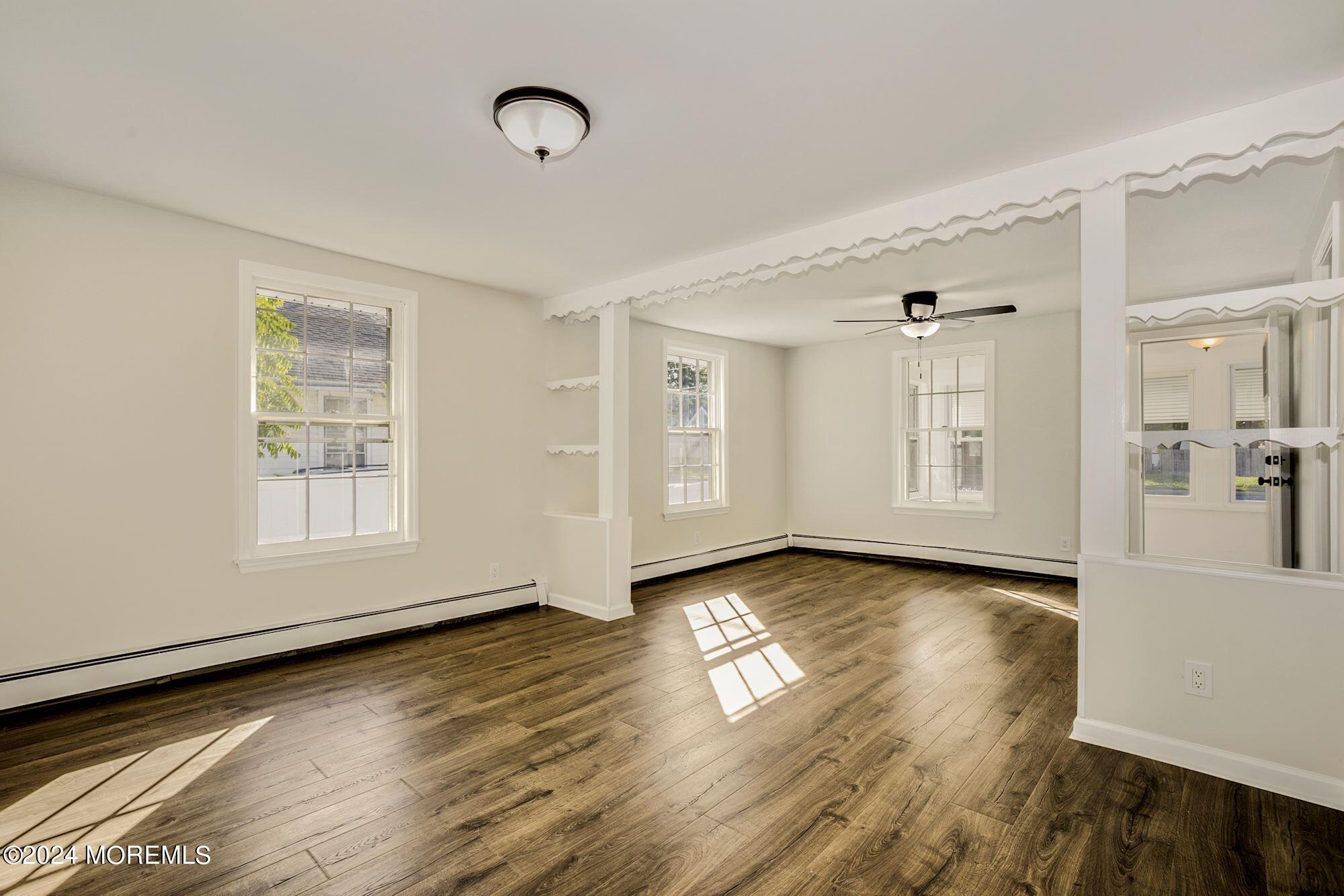 198 Newman Springs Road Red Bank, NJ 07701 - Photo 6 of 13 a view of a room with wooden floor and window