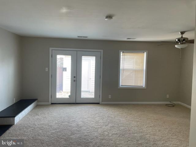 17439 Hughes Road Poolesville, MD 20837 - Photo 11 of 25 an empty room with a empty space and windows
