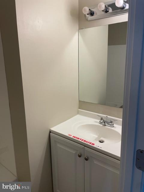 17439 Hughes Road Poolesville, MD 20837 - Photo 16 of 25 a bathroom with a sink and a mirror