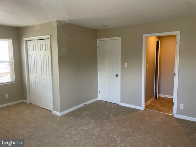 17439 Hughes Road Poolesville, MD 20837 - Photo 21 of 25 a view of an empty room with windows and closet