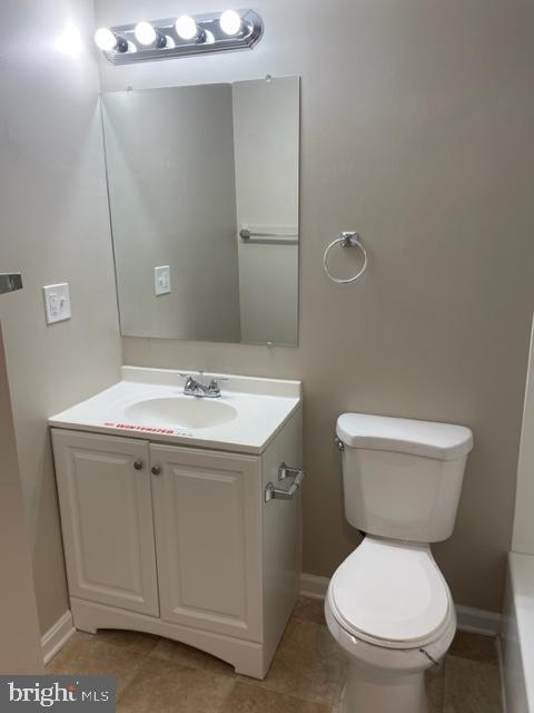 17439 Hughes Road Poolesville, MD 20837 - Photo 22 of 25 a bathroom with a toilet sink and mirror