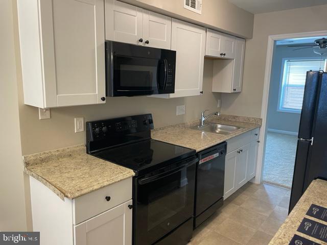 17439 Hughes Road Poolesville, MD 20837 - Photo 8 of 25 a kitchen with a sink stove and microwave