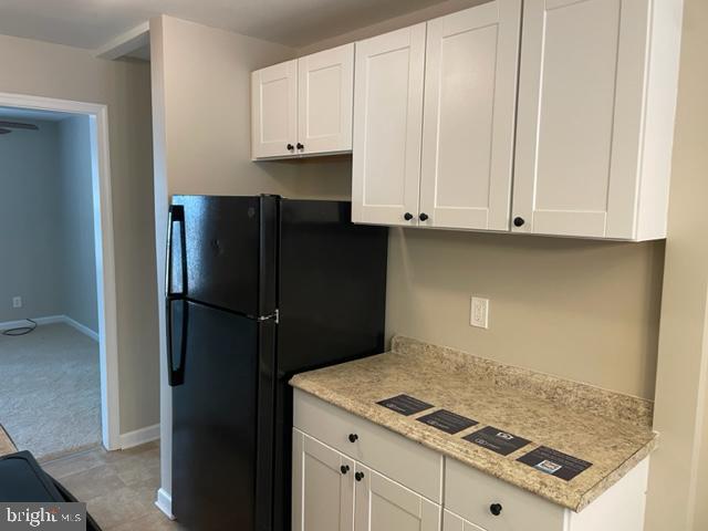 17439 Hughes Road Poolesville, MD 20837 - Photo 9 of 25 a kitchen with refrigerator and cabinets