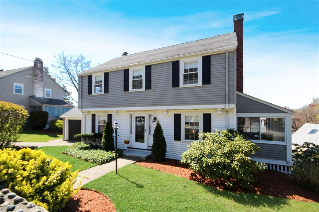 106 Channing Road Watertown, MA 02472 - Photo 1 of 39 a view of a house with a yard and plants