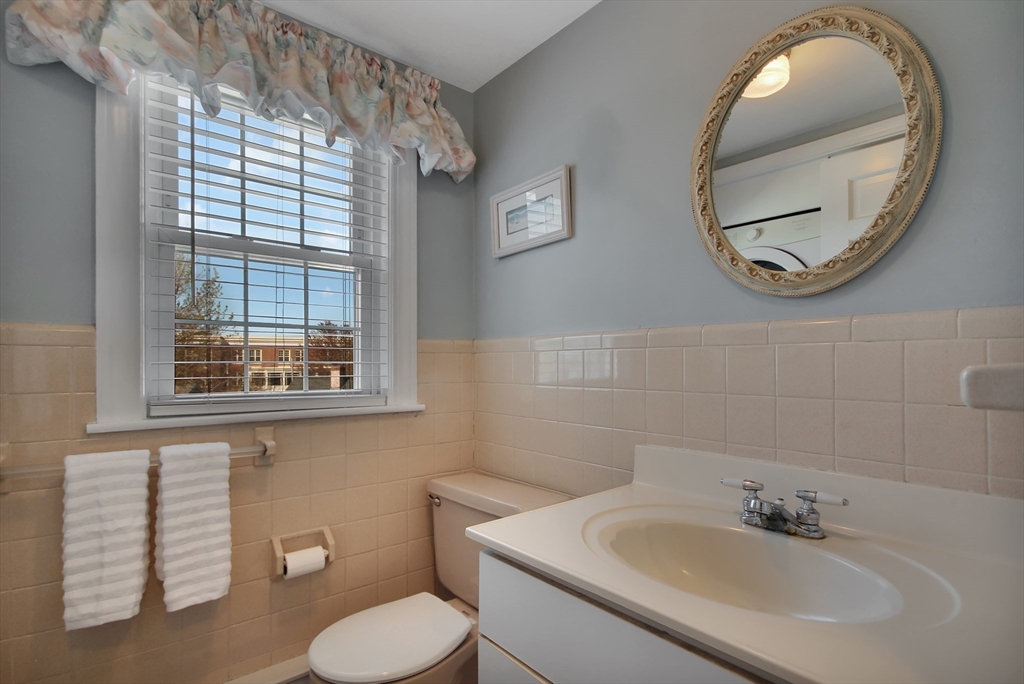 106 Channing Road Watertown, MA 02472 - Photo 19 of 39 a bathroom with a sink and a mirror