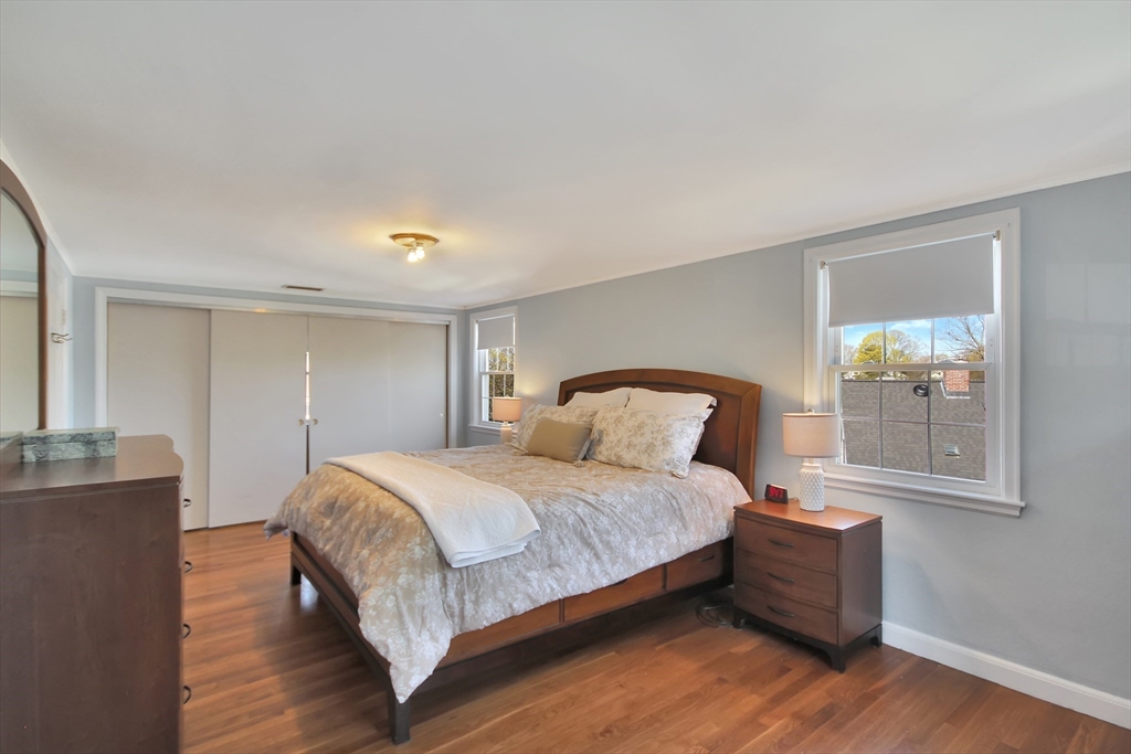 106 Channing Road Watertown, MA 02472 - Photo 22 of 39 a bedroom with a bed and wooden floor