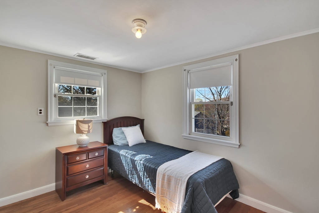 106 Channing Road Watertown, MA 02472 - Photo 24 of 39 a bedroom with a bed and a window
