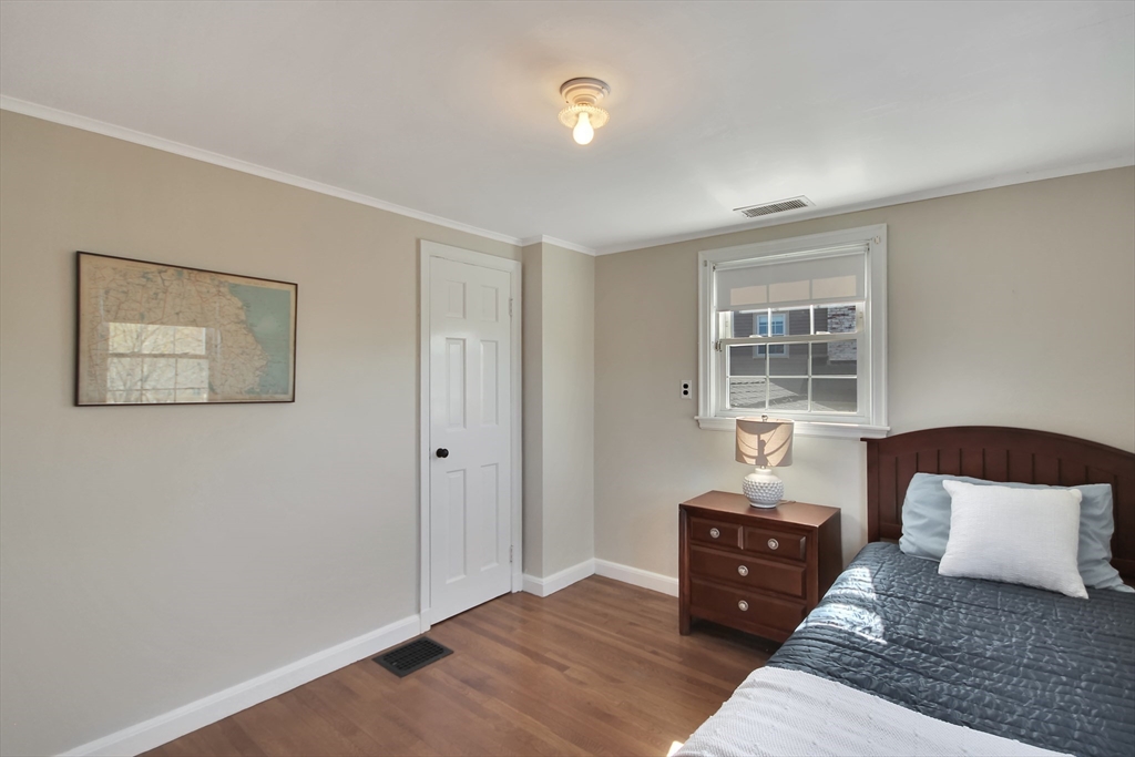 106 Channing Road Watertown, MA 02472 - Photo 25 of 39 a bedroom with a bed and wooden floor