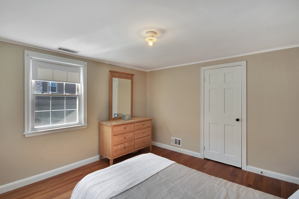 106 Channing Road Watertown, MA 02472 - Photo 27 of 39 a bedroom with a bed and a window