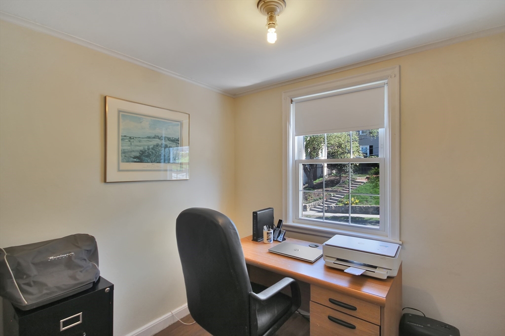 106 Channing Road Watertown, MA 02472 - Photo 28 of 39 a view of a workspace with furniture and a window