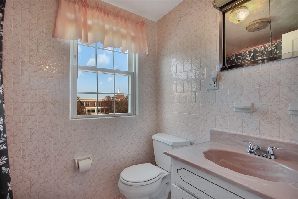 106 Channing Road Watertown, MA 02472 - Photo 29 of 39 a bathroom with a sink a toilet and shower