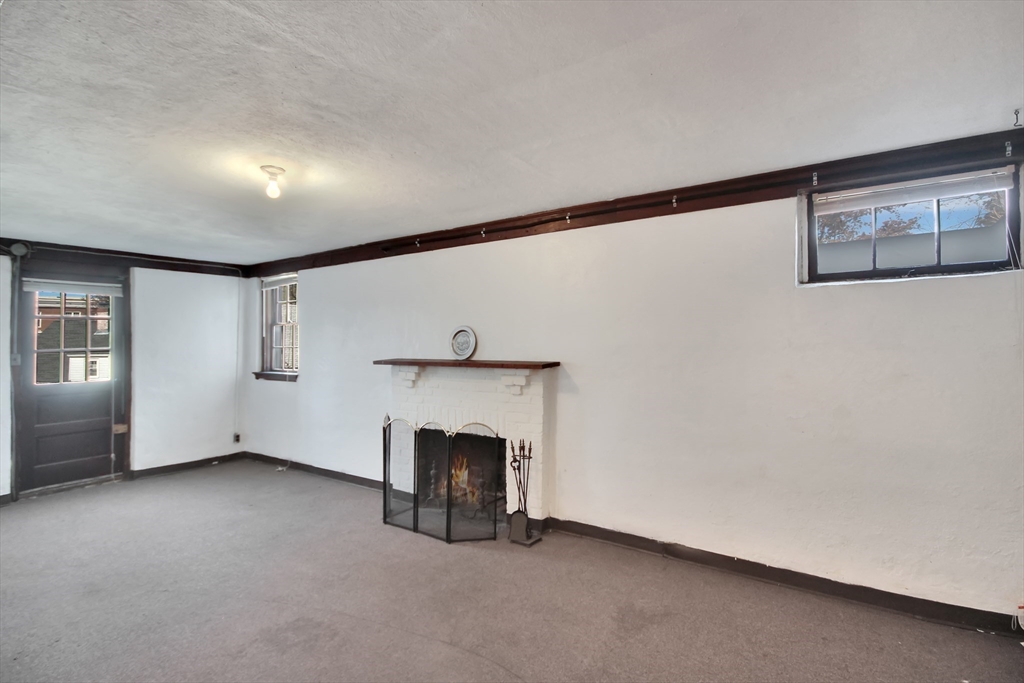 106 Channing Road Watertown, MA 02472 - Photo 30 of 39 a view of empty room with fireplace