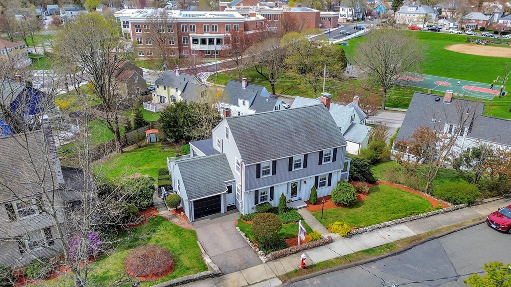 106 Channing Road Watertown, MA 02472 - Photo 5 of 39 an aerial view of multiple houses with a yard
