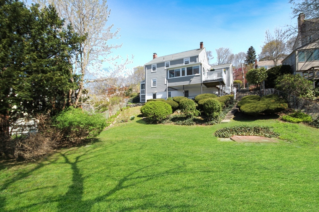 106 Channing Road Watertown, MA 02472 - Photo 6 of 39 a view of a house with a yard