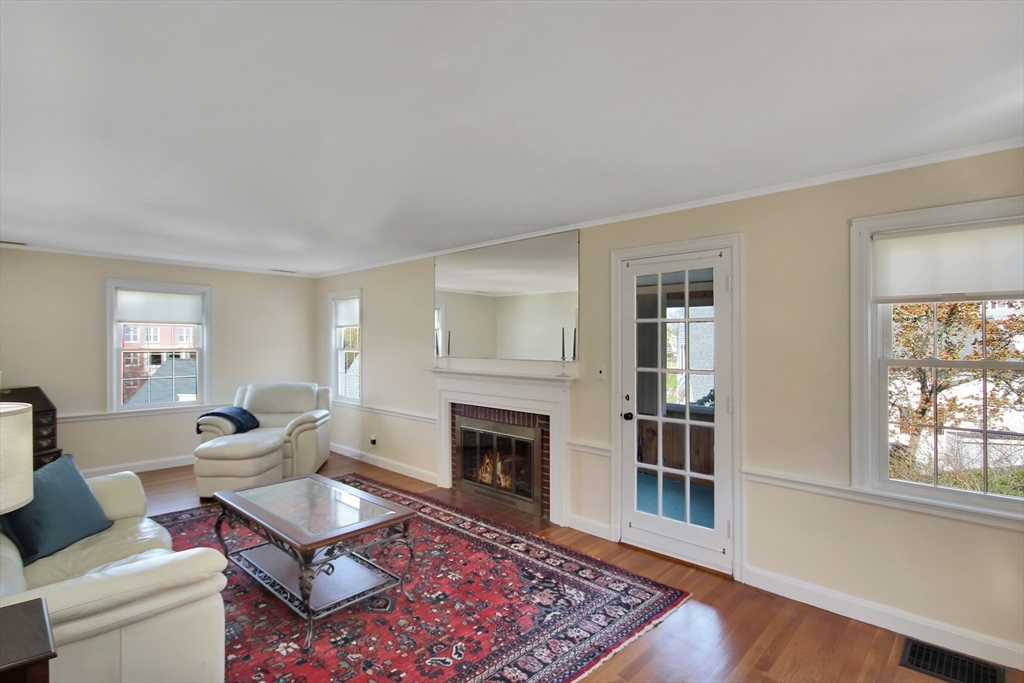 106 Channing Road Watertown, MA 02472 - Photo 8 of 39 a living room with furniture a rug and a fireplace