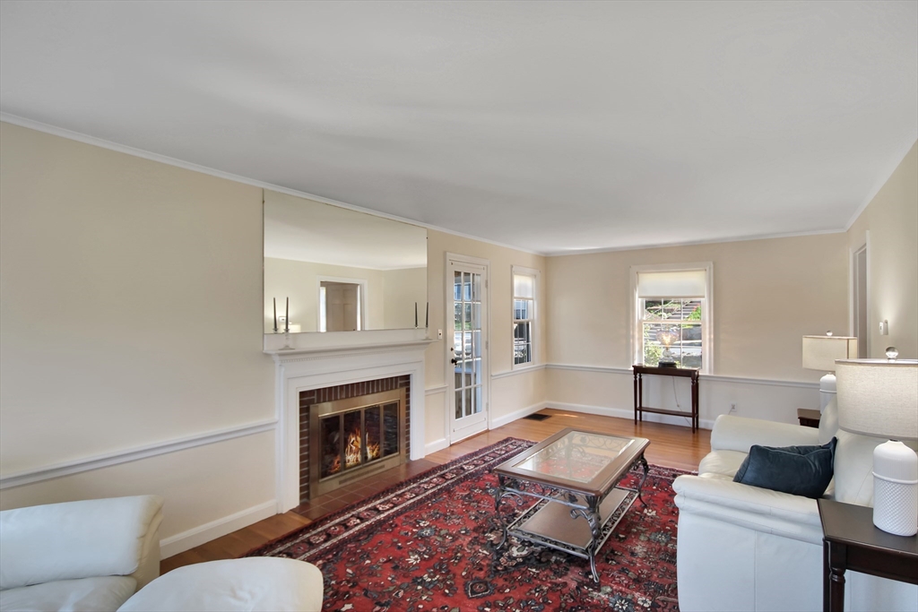 106 Channing Road Watertown, MA 02472 - Photo 9 of 39 a living room with furniture and a fireplace