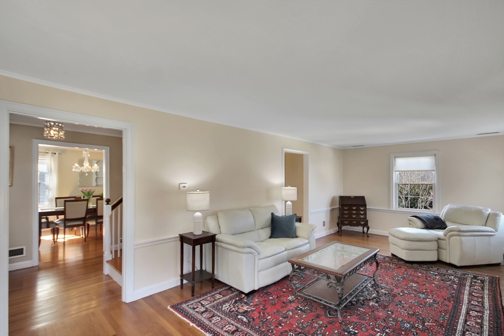 106 Channing Road Watertown, MA 02472 - Photo 10 of 39 a living room with furniture wooden floor and a window